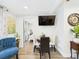 Inviting dining area with a modern table set and mounted TV at 2222 12Th Nw St, Winter Haven, FL 33881