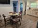 Eat-in kitchen includes dining table, access to living and bed rooms, and updated kitchen at 2222 12Th Nw St, Winter Haven, FL 33881