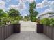 View of a spacious driveway with decorative plants and landscaping at 2222 12Th Nw St, Winter Haven, FL 33881