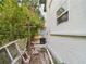 Exterior view along the side of the home with landscaping and a stone pathway at 2222 12Th Nw St, Winter Haven, FL 33881