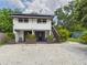Charming two-story home with a unique design, complemented by well-kept landscaping at 2222 12Th Nw St, Winter Haven, FL 33881