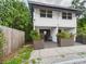 Charming home featuring a covered entry, decorative planters, and a serene, welcoming atmosphere at 2222 12Th Nw St, Winter Haven, FL 33881