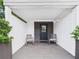 Charming front porch welcomes you with seating, creating a cozy and inviting entrance at 2222 12Th Nw St, Winter Haven, FL 33881