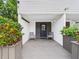 Charming front porch welcomes you with seating, creating a cozy and inviting entrance at 2222 12Th Nw St, Winter Haven, FL 33881