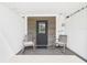 Covered front porch with seating and a view of the main entrance at 2222 12Th Nw St, Winter Haven, FL 33881