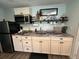 Well-appointed kitchen with white cabinetry, modern appliances, and a functional countertop space at 2222 12Th Nw St, Winter Haven, FL 33881