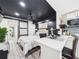 A bedroom flows nicely into a kitchen area complete with bar-style seating at 2222 12Th Nw St, Winter Haven, FL 33881
