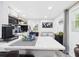 Bright kitchen featuring a large island, white cabinets, stainless steel appliances, and modern decor at 2222 12Th Nw St, Winter Haven, FL 33881