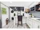This modern kitchen offers bar-style seating and sleek countertops at 2222 12Th Nw St, Winter Haven, FL 33881