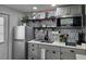 Charming kitchen featuring stainless steel appliances, stylish backsplash, and open shelving at 2222 12Th Nw St, Winter Haven, FL 33881