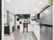 This efficient kitchen offers modern appliances and a cozy breakfast bar with bar seating and hardwood floors at 2222 12Th Nw St, Winter Haven, FL 33881