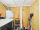 This laundry room features a new hot water tank and plenty of space for storing cleaning equipment at 2222 12Th Nw St, Winter Haven, FL 33881