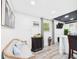 Inviting living room features a comfortable seating area, stylish decor, and plenty of natural light from the window at 2222 12Th Nw St, Winter Haven, FL 33881