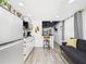 Compact living area with a modern kitchen, seating, and plenty of natural light at 2222 12Th Nw St, Winter Haven, FL 33881