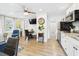 Inviting living area featuring modern appliances, a dining area and a tiled bathroom at 2222 12Th Nw St, Winter Haven, FL 33881