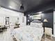 Comfortable bedroom has an open view to the kitchen and living space at 2222 12Th Nw St, Winter Haven, FL 33881