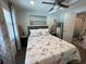 Serene bedroom featuring a bed with nautical bedding, decorative lamps, and access to an en-suite bathroom at 2222 12Th Nw St, Winter Haven, FL 33881