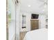 Cozy main bedroom featuring light walls, wood floors, and a flat screen television at 2222 12Th Nw St, Winter Haven, FL 33881