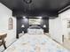 Bedroom has dark accent wall, and a decorative ceiling fan and light at 2222 12Th Nw St, Winter Haven, FL 33881