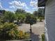 Spacious parking area with well-maintained landscaping and mature trees at 2222 12Th Nw St, Winter Haven, FL 33881