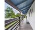 Exterior photo showcasing a covered porch offering shade and a comfortable space to relax outdoors at 2222 12Th Nw St, Winter Haven, FL 33881