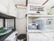 Efficient storage solution with plastic bins and shelves in a well-organized space at 2222 12Th Nw St, Winter Haven, FL 33881