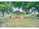 Cozy home featuring a wooden deck and lush greenery, perfect for outdoor activities and enjoying scenic views at 230 Denton Ave, Auburndale, FL 33823