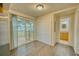 Bright dining area with sliding glass doors leading to an outdoor deck at 230 Denton Ave, Auburndale, FL 33823