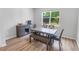 A dining area with a modern table set near a window at 2356 Palm Park Loop, Clermont, FL 34714