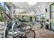 Well-equipped gym with treadmills, elliptical machines, and weight training equipment for residents at 2356 Palm Park Loop, Clermont, FL 34714