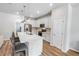 Bright kitchen featuring stainless steel appliances, a quartz countertop island, and white cabinets at 2356 Palm Park Loop, Clermont, FL 34714