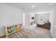 A loft featuring neutral colors, natural light, and carpeted floors at 2356 Palm Park Loop, Clermont, FL 34714