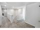 Second floor loft featuring neutral colors, a safety gate, and carpeted floors at 2356 Palm Park Loop, Clermont, FL 34714