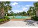 Community splash pad with interactive water features and playful design for Gathering fun in a lush tropical setting at 2356 Palm Park Loop, Clermont, FL 34714