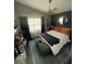 This cozy bedroom features stylish decor, ceiling fan and lots of natural light at 2516 Woodgate Blvd # 205, Orlando, FL 32822