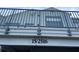 Exterior shot showcasing the building number and balcony railing at 2516 Woodgate Blvd # 205, Orlando, FL 32822