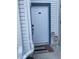 Inviting condo front door with a digital lock and a blue trim at 2516 Woodgate Blvd # 205, Orlando, FL 32822
