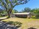 Charming brick home with a well-maintained lawn and metal roof at 2640 Handley Blvd, Lakeland, FL 33803