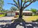 Charming single-story home featuring a two-car garage and a vibrant red front door at 2640 Handley Blvd, Lakeland, FL 33803