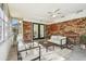 Enclosed sunroom featuring brick walls, tile floors and ample seating with indoor-outdoor feel at 2640 Handley Blvd, Lakeland, FL 33803