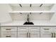 Close up of a wet bar with white countertops and black hardware at 2640 Handley Blvd, Lakeland, FL 33803