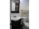 Cozy bathroom with a dark vanity and decorative towels at 266 Las Flores, Winter Haven, FL 33884