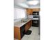 Kitchen features modern appliances, granite countertops and tiled floors at 266 Las Flores, Winter Haven, FL 33884