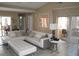 Spacious living room featuring contemporary furniture, tiled floors, and sliding glass doors to a patio at 266 Las Flores, Winter Haven, FL 33884