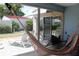 Enclosed patio with hammock and seating at 266 Las Flores, Winter Haven, FL 33884