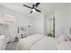 Bright bedroom featuring a vanity with a mirror, a bed, and closet space, creating a stylish and functional retreat at 287 Lake Smart Cir, Winter Haven, FL 33881