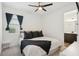 Cozy bedroom featuring a comfortable bed, stylish decor, and an en-suite bathroom, creating a relaxing retreat at 287 Lake Smart Cir, Winter Haven, FL 33881