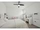Charming bedroom featuring a comfortable bed, vanity with a mirror, and ample natural light for a cozy retreat at 287 Lake Smart Cir, Winter Haven, FL 33881