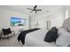 Modern bedroom features a television and seating for relaxation at 287 Lake Smart Cir, Winter Haven, FL 33881