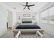 Bright bedroom with a tufted headboard bed, lots of natural light, and a ceiling fan at 287 Lake Smart Cir, Winter Haven, FL 33881